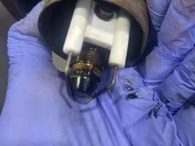 Old Burner Nozzle And Electrodes Before Service